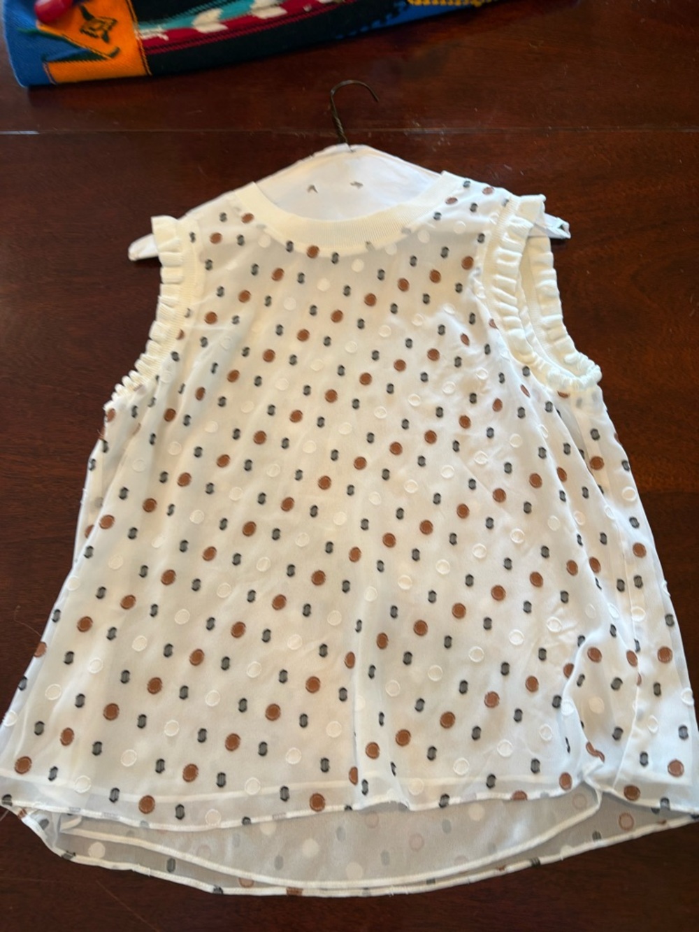 White Sleeveless Polka Dot Blouse with Ruffle Trim